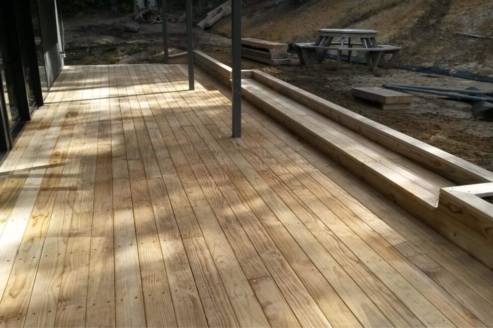 Wide board pine deck with step